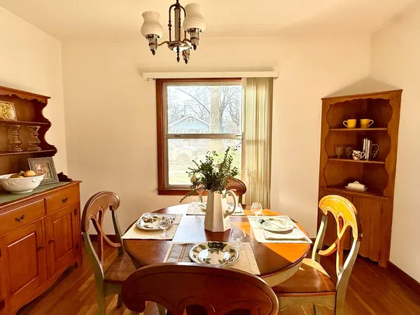 a view of a dining room with furniture window and outside view