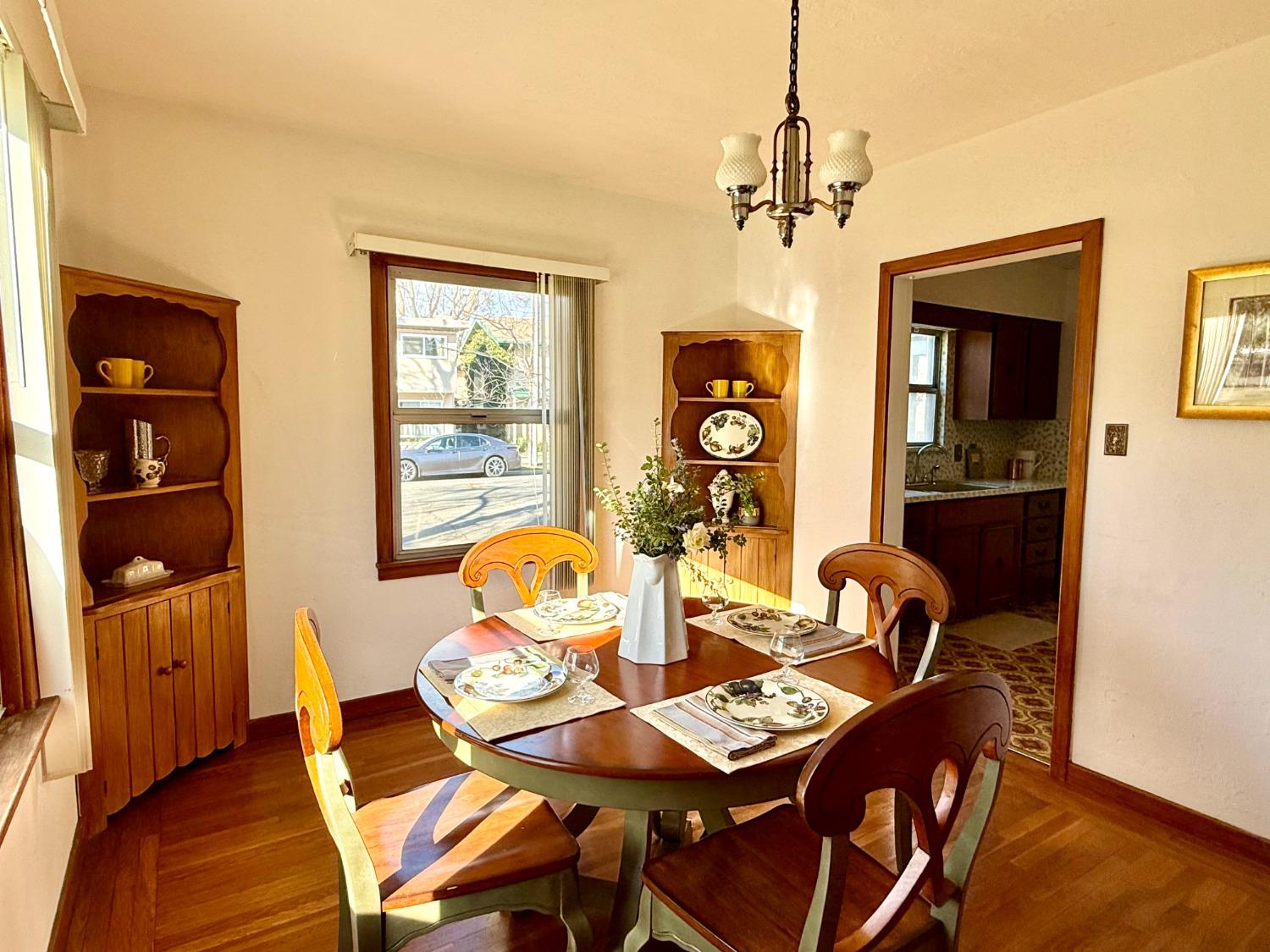 646 F Street Davis, CA 95616 - Photo 15 of 33 a view of a dining room with furniture window and wooden floor