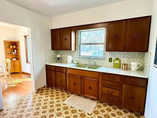 a bathroom with a sink double vanity and a mirror