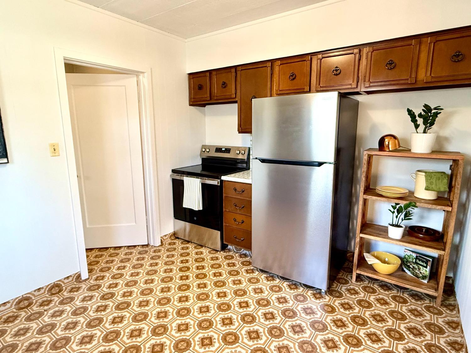 646 F Street Davis, CA 95616 - Photo 19 of 33 a white refrigerator freezer sitting inside of a kitchen