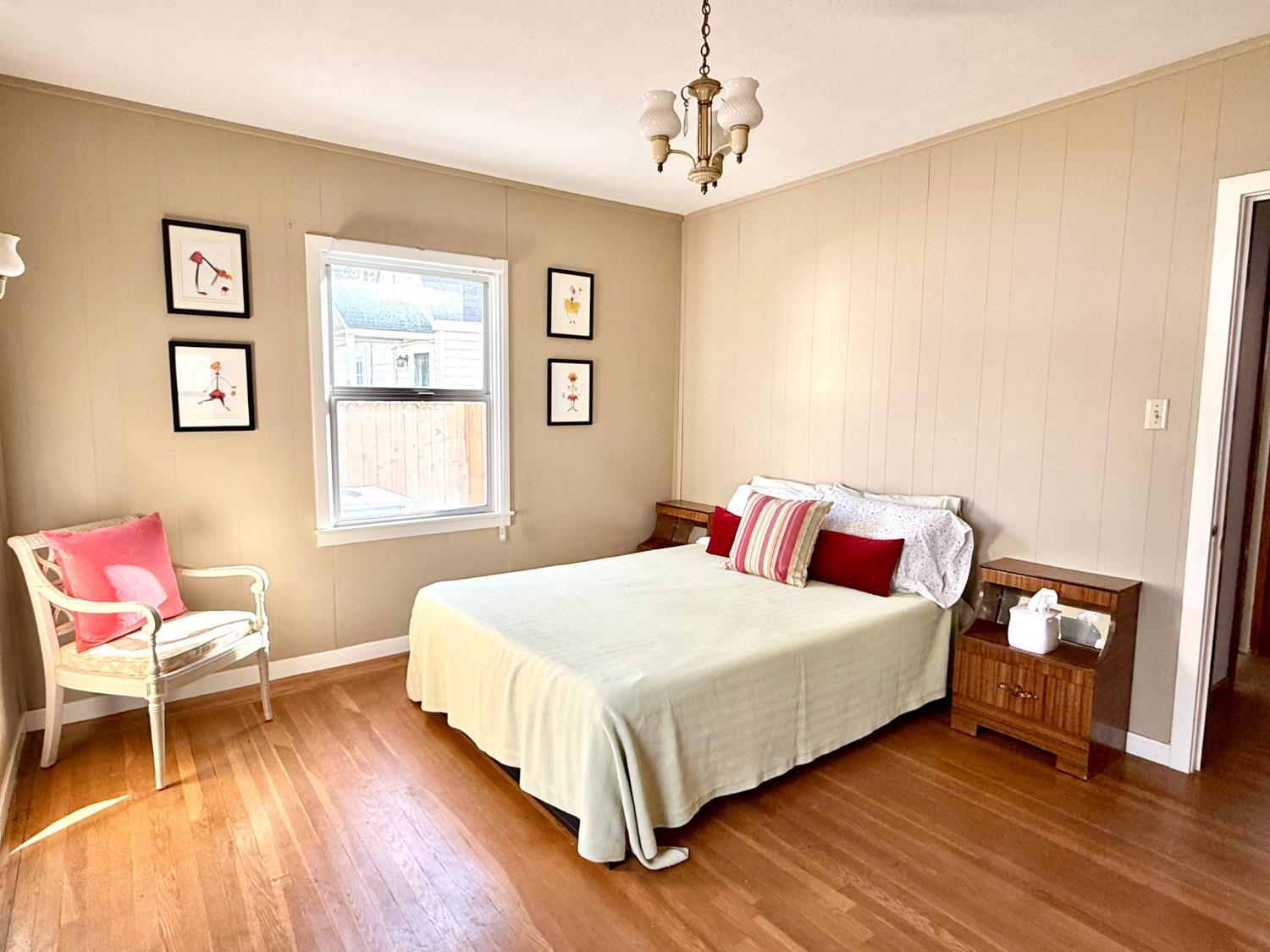 646 F Street Davis, CA 95616 - Photo 26 of 33 a bedroom with a bed and a chair