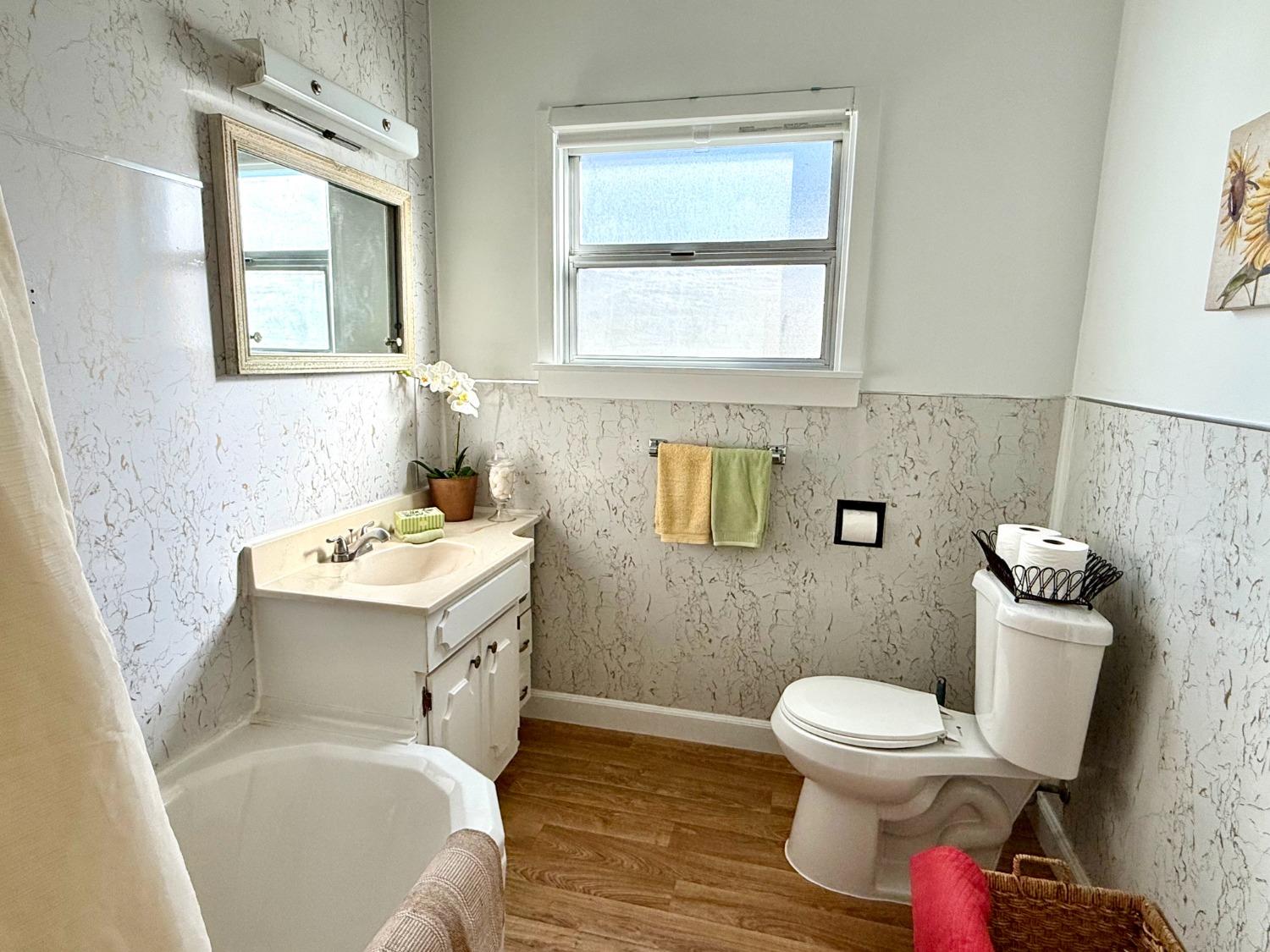 646 F Street Davis, CA 95616 - Photo 29 of 33 a bathroom with a toilet sink and mirror