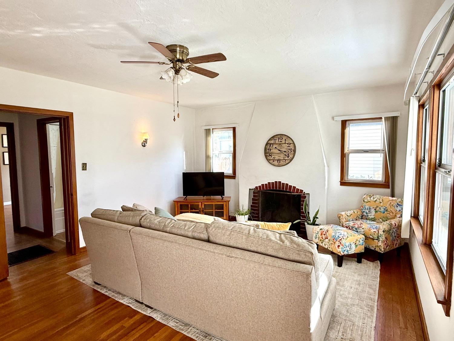 646 F Street Davis, CA 95616 - Photo 3 of 33 a living room with furniture a fireplace and a window