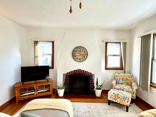 a bedroom with bed and a flat screen tv