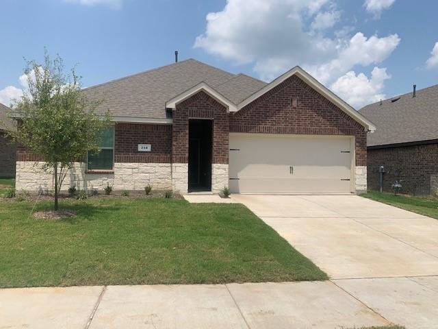 712 Feldspar Way Princeton, TX 75407 - Photo 1 of 12 Brick and stone veneer exterior with a gabled roofline