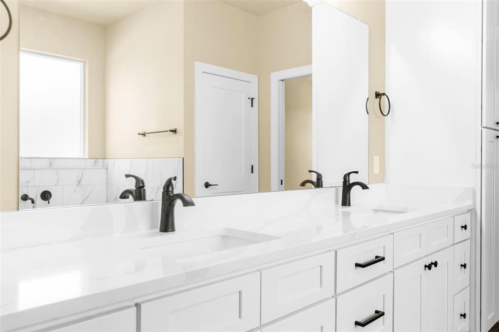 16143 Penn State Road Weeki Wachee, FL 34614 - Photo 11 of 45 a bathroom with a sink and a mirror