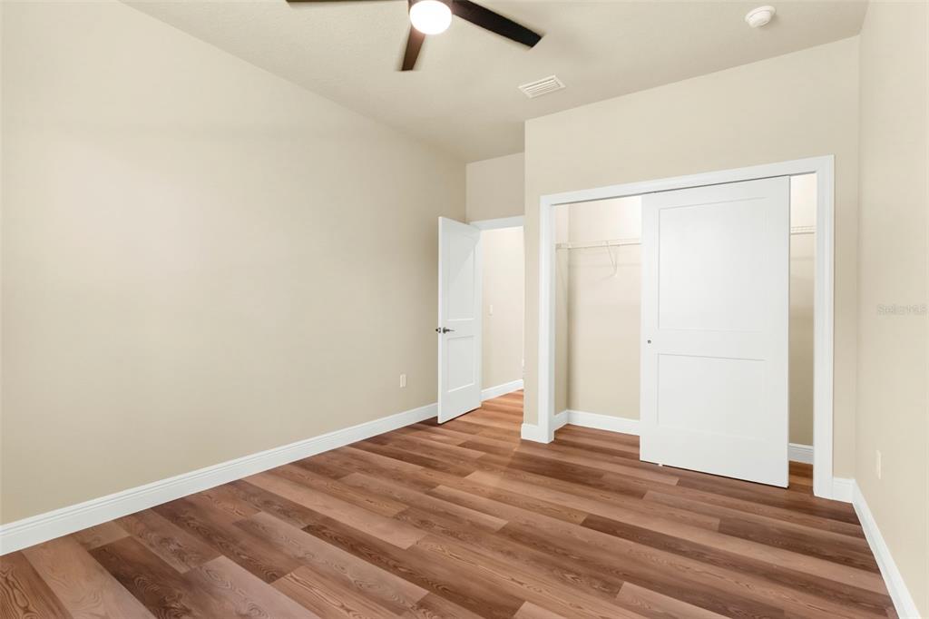 16143 Penn State Road Weeki Wachee, FL 34614 - Photo 14 of 45 wooden floor in an empty room