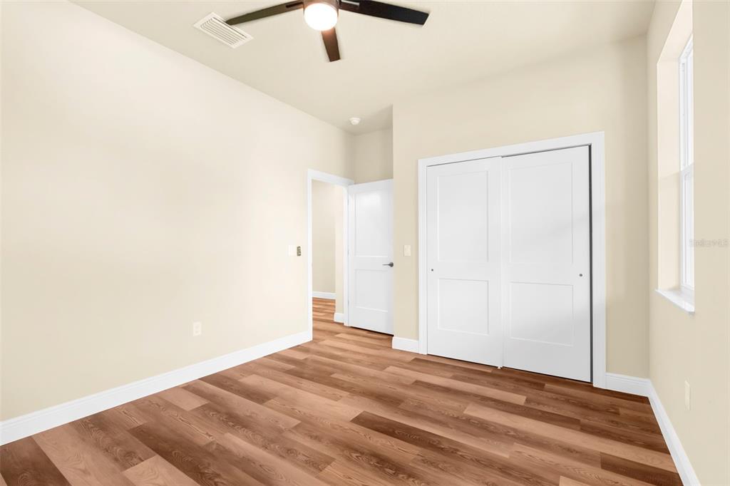 16143 Penn State Road Weeki Wachee, FL 34614 - Photo 19 of 45 a view of a big room with wooden floor