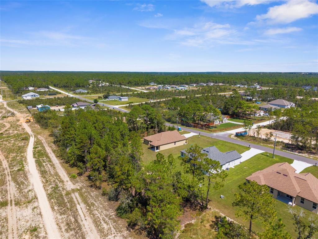 16143 Penn State Road Weeki Wachee, FL 34614 - Photo 40 of 45 an aerial view of residential houses with outdoor space and swimming pool