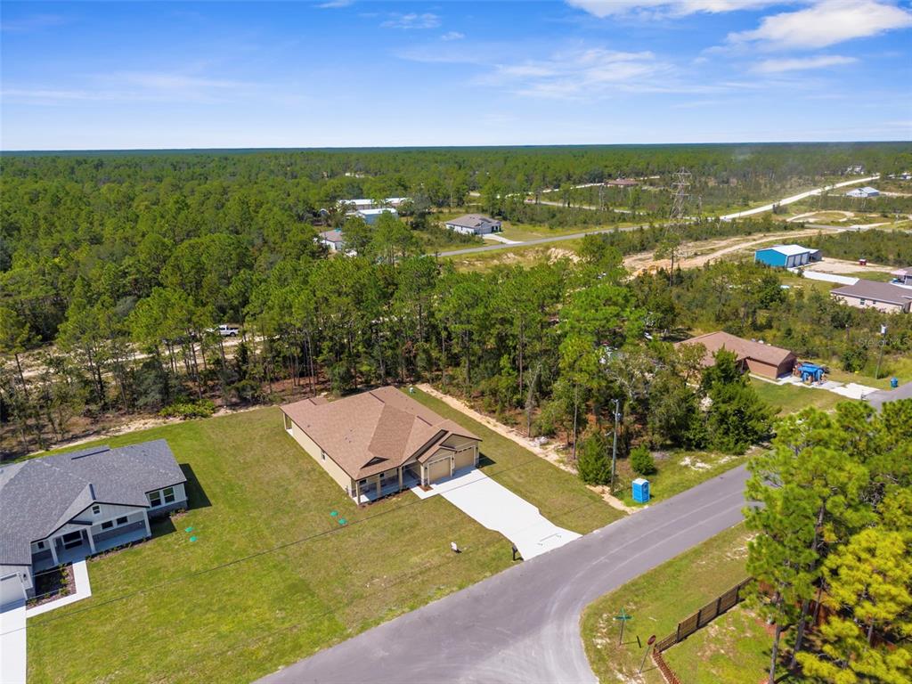 16143 Penn State Road Weeki Wachee, FL 34614 - Photo 44 of 45 an aerial view of residential houses with outdoor space and swimming pool