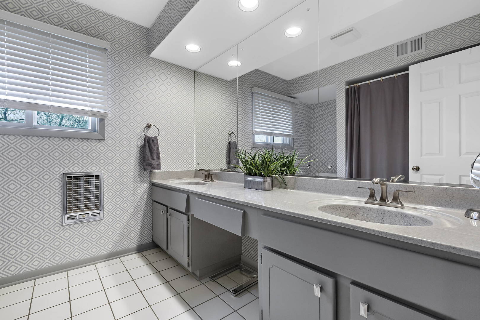 1841 Birch Road Northbrook, IL 60062 - Photo 11 of 18 a bathroom with a sink double vanity and a mirror