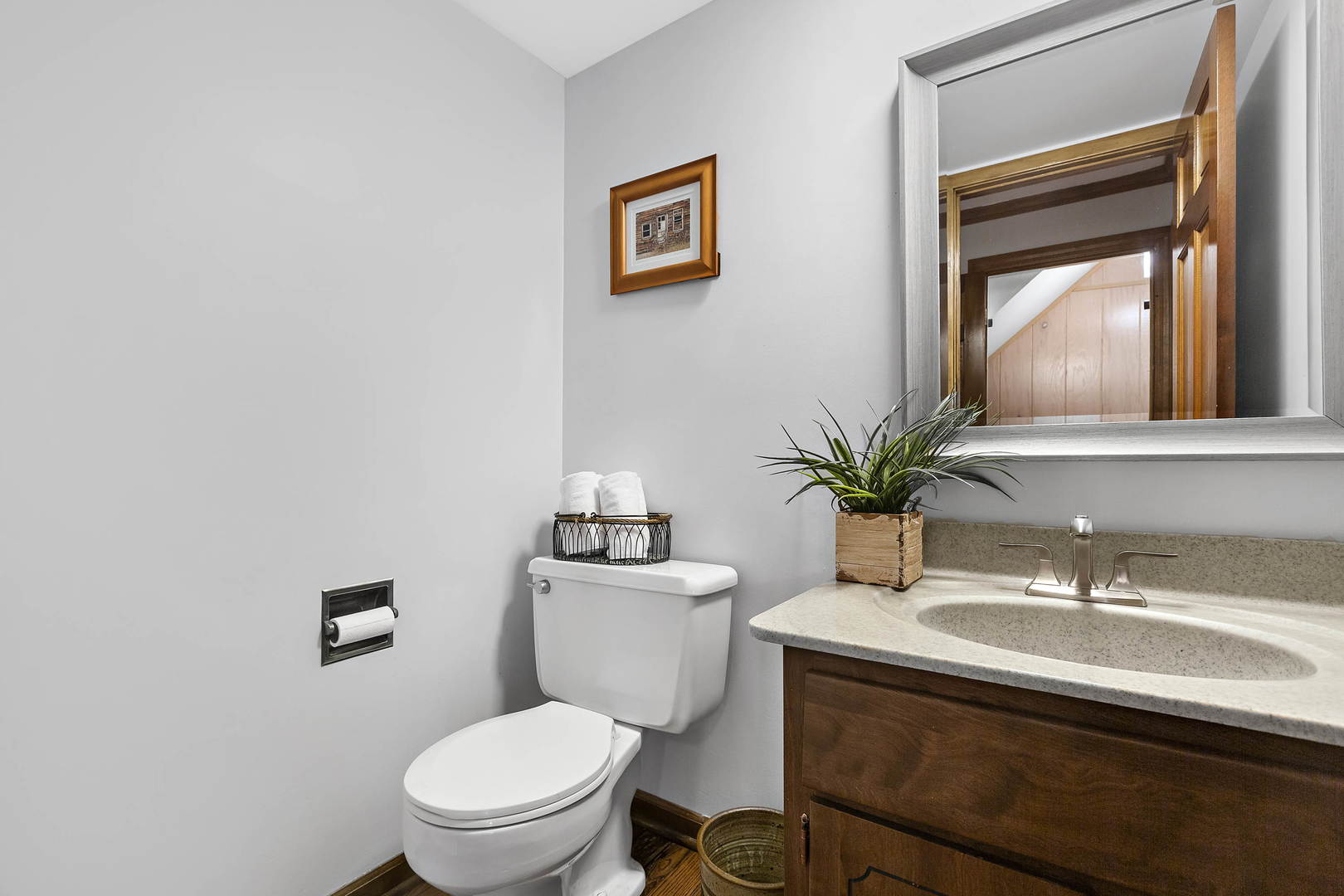1841 Birch Road Northbrook, IL 60062 - Photo 14 of 18 a bathroom with a toilet a sink and mirror