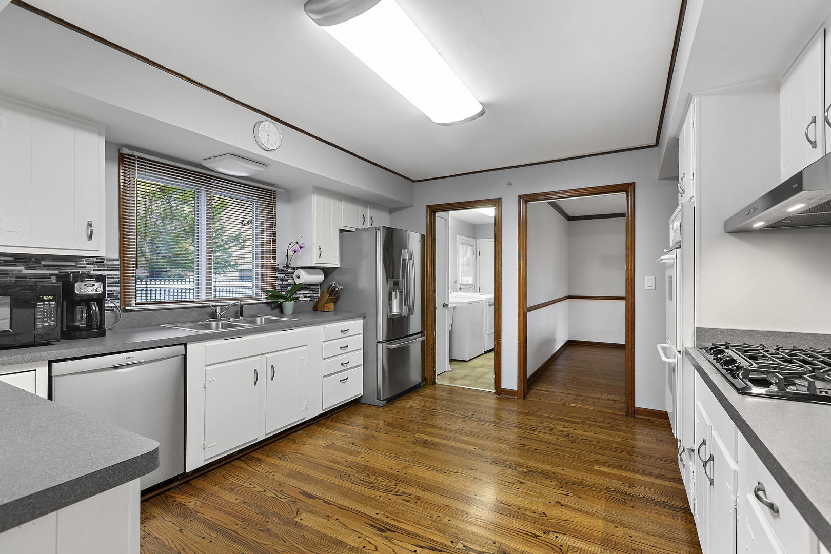 1841 Birch Road Northbrook, IL 60062 - Photo 6 of 18 a kitchen with stainless steel appliances granite countertop a stove and a refrigerator