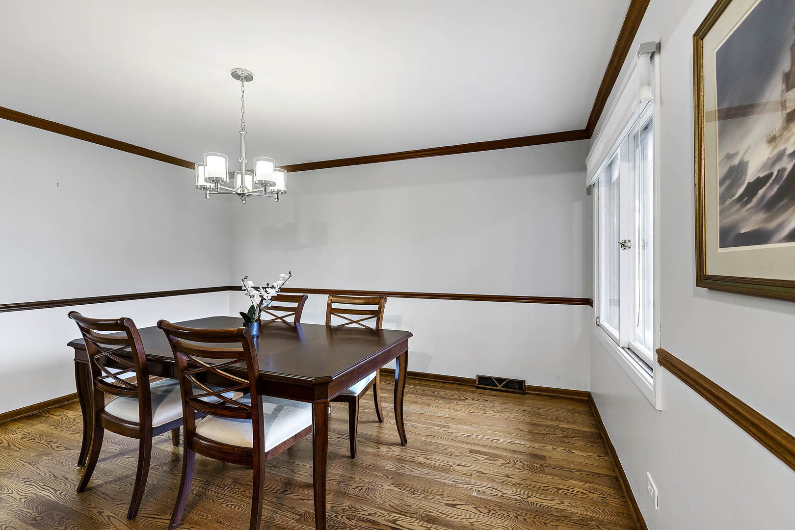1841 Birch Road Northbrook, IL 60062 - Photo 7 of 18 a view of a dining room with furniture and wooden floor