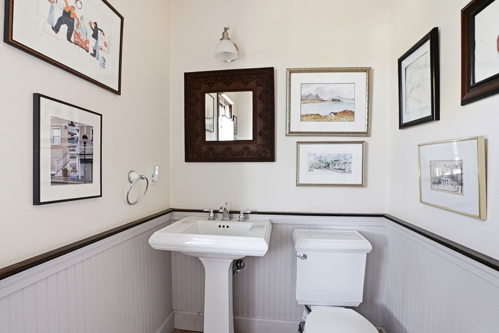 34 Governor Long Road Hingham, MA 02043 - Photo 27 of 37 a bathroom with a toilet a sink and mirror