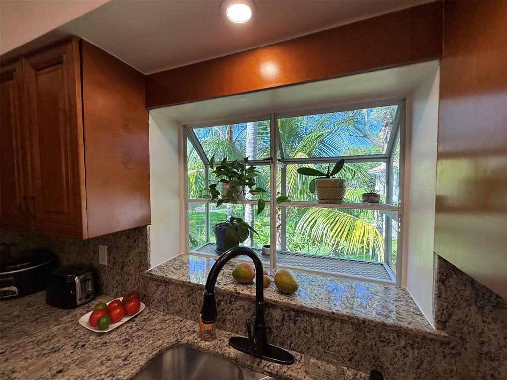 9237 Northwest 9th Place, Unit 9237 Plantation, FL 33324 - Photo 14 of 44 a room with furniture and a potted plant