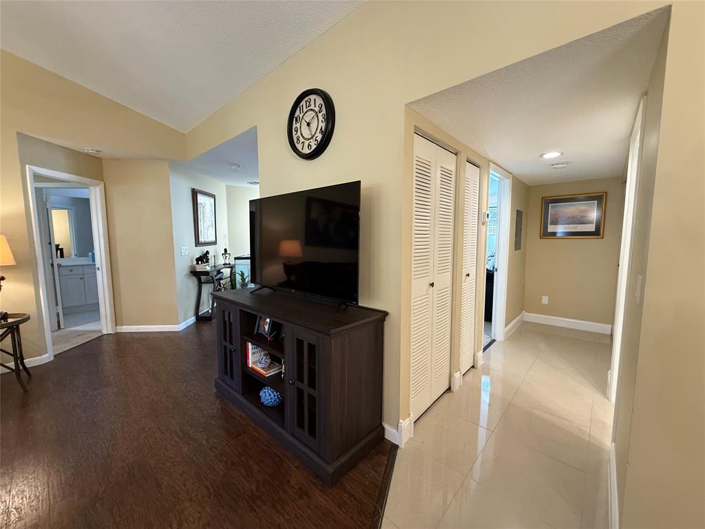 9237 Northwest 9th Place, Unit 9237 Plantation, FL 33324 - Photo 16 of 44 a living room with furniture and a flat screen tv