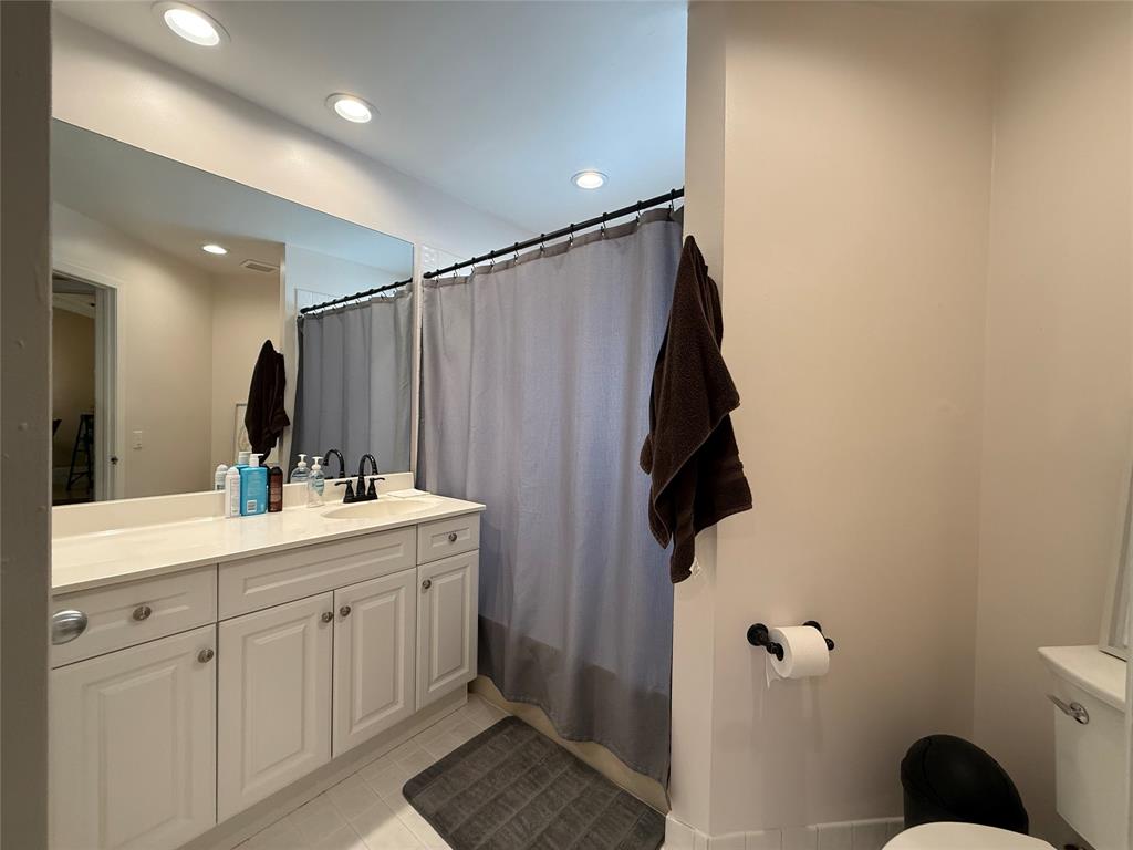 9237 Northwest 9th Place, Unit 9237 Plantation, FL 33324 - Photo 22 of 44 a bathroom with a sink toilet and shower
