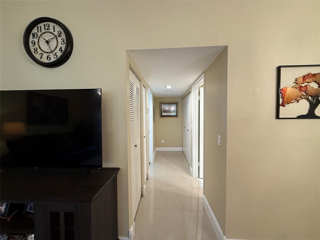 9237 Northwest 9th Place, Unit 9237 Plantation, FL 33324 - Photo 24 of 44 a view of a hallway with elevator