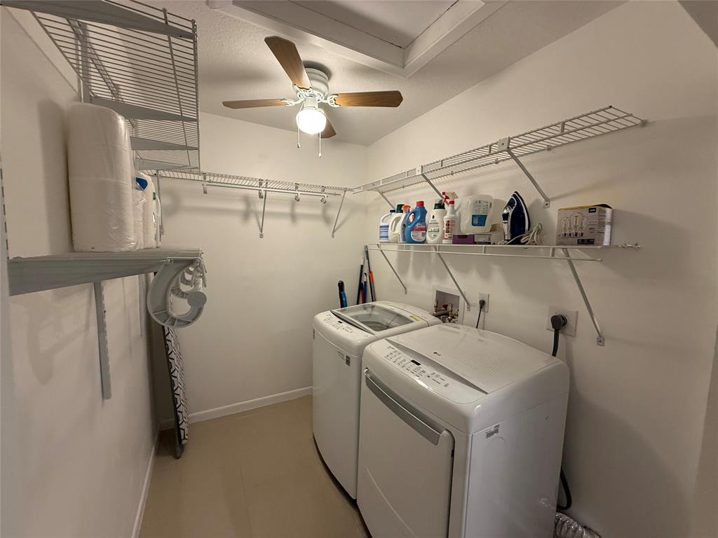 9237 Northwest 9th Place, Unit 9237 Plantation, FL 33324 - Photo 28 of 44 a utility room with dryer and washer