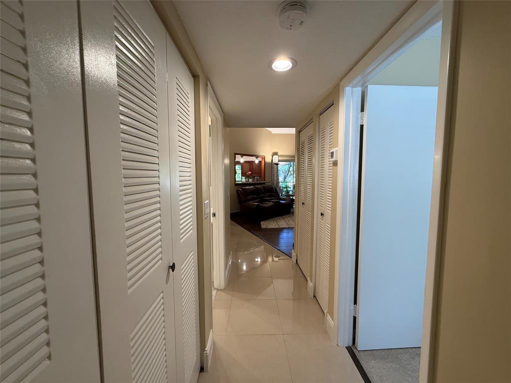 9237 Northwest 9th Place, Unit 9237 Plantation, FL 33324 - Photo 29 of 44 a view of hallway with wooden floor