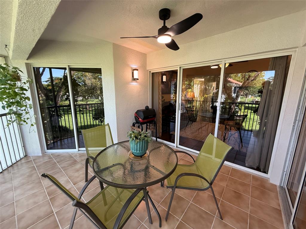 9237 Northwest 9th Place, Unit 9237 Plantation, FL 33324 - Photo 30 of 44 a view of a dining room with furniture window and outside view