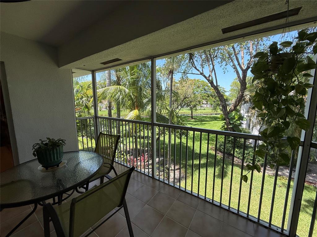 9237 Northwest 9th Place, Unit 9237 Plantation, FL 33324 - Photo 32 of 44 a view of a city from a dining room with furniture