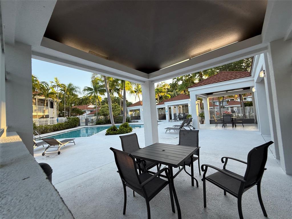 9237 Northwest 9th Place, Unit 9237 Plantation, FL 33324 - Photo 43 of 44 a view of a dining room with furniture and window