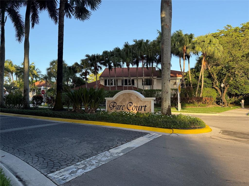9237 Northwest 9th Place, Unit 9237 Plantation, FL 33324 - Photo 44 of 44 a view of swimming pool with palm trees