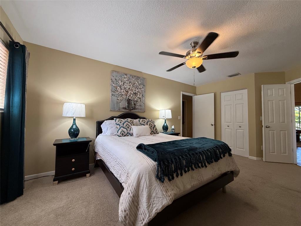 9237 Northwest 9th Place, Unit 9237 Plantation, FL 33324 - Photo 7 of 44 a bedroom with a bed and a chandelier