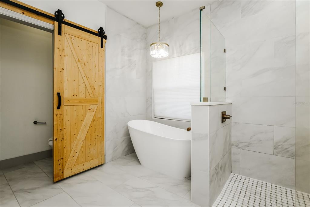 71 Westcedar Lane Palm Coast, FL 32164 - Photo 11 of 20 a bathroom with a shower