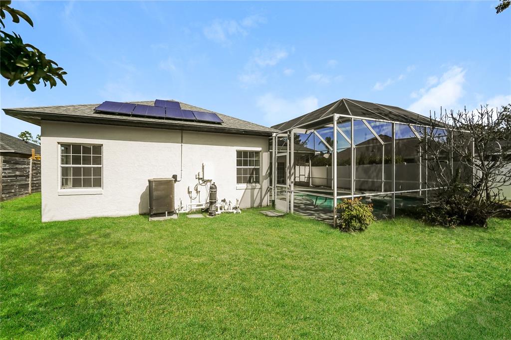 71 Westcedar Lane Palm Coast, FL 32164 - Photo 19 of 20 a view of a house with a backyard