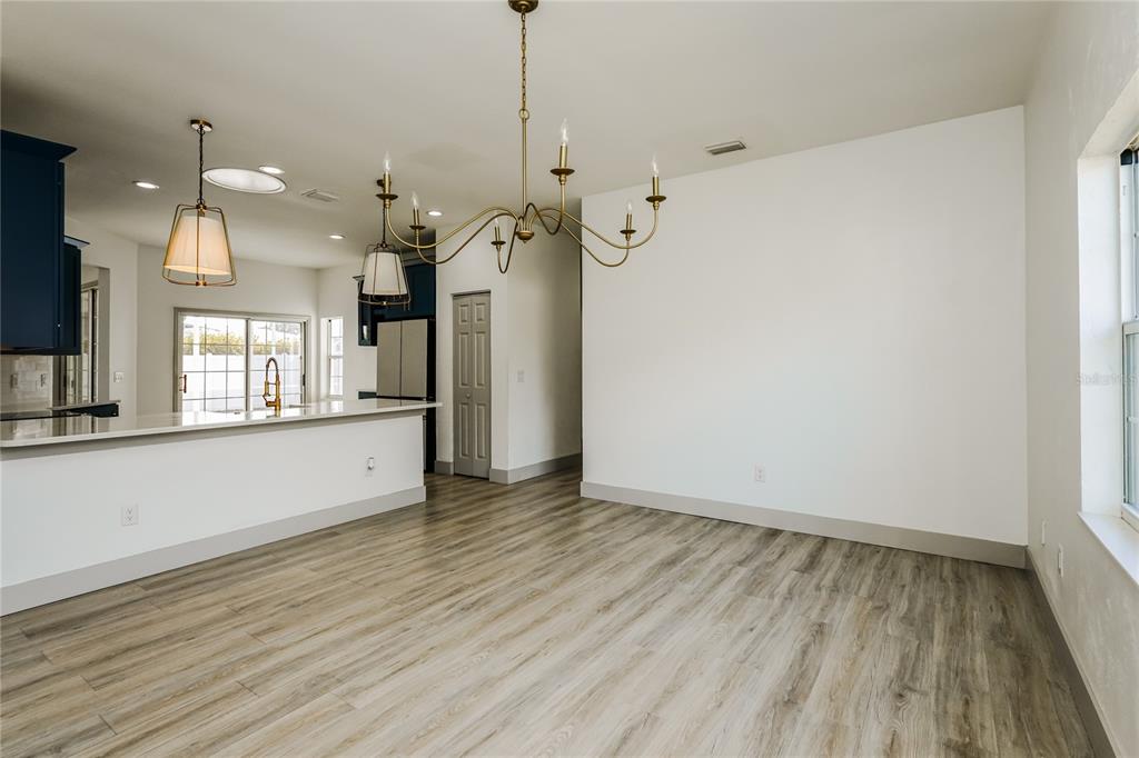 71 Westcedar Lane Palm Coast, FL 32164 - Photo 8 of 20 a view of a room with wooden floor and windows