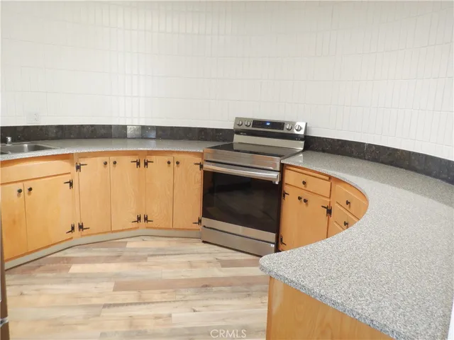 a living room with a bed furniture and a window