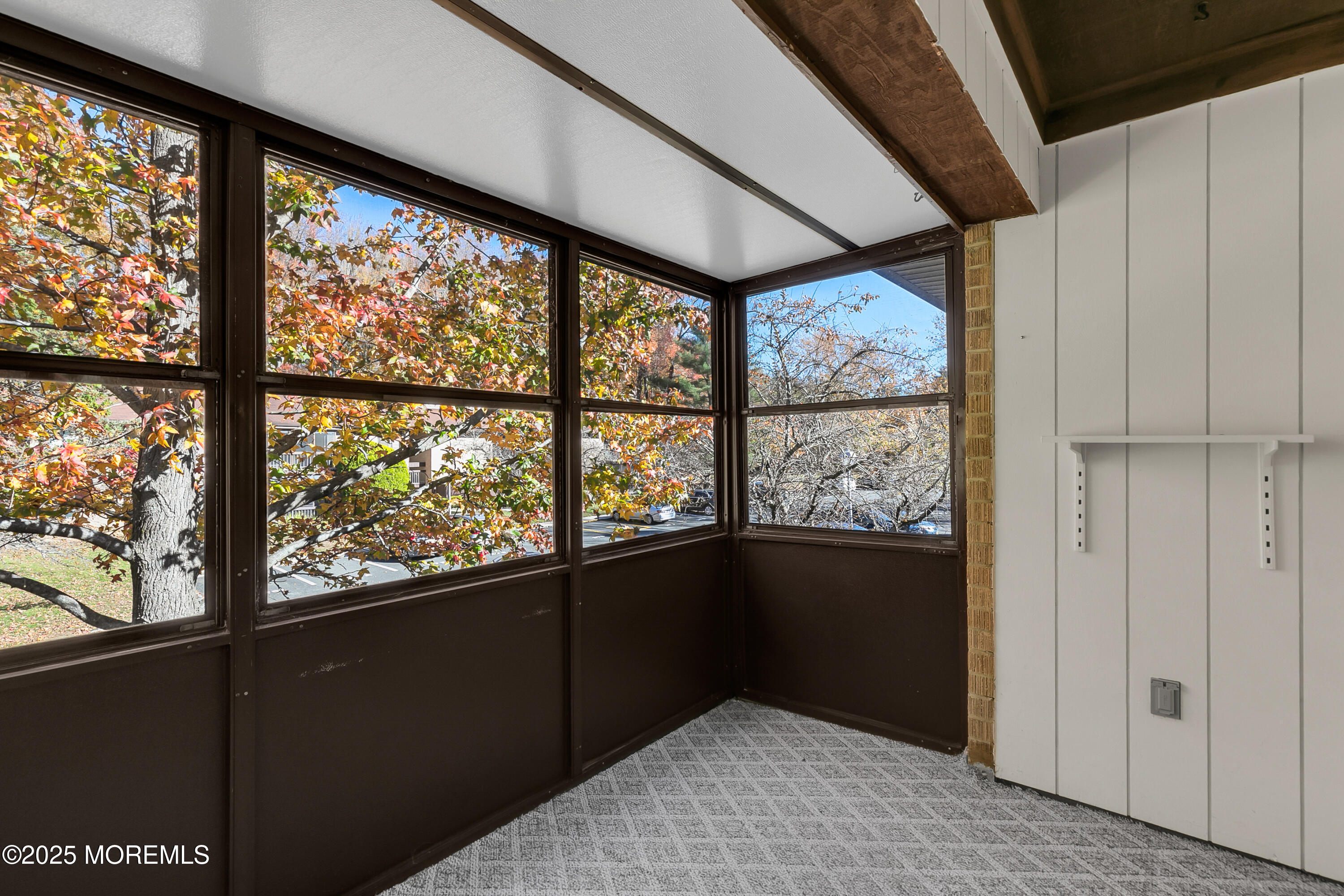 26 Meadow Green Circle, Unit K Manalapan, NJ 07726 - Photo 12 of 27 a view of an empty room with a large window