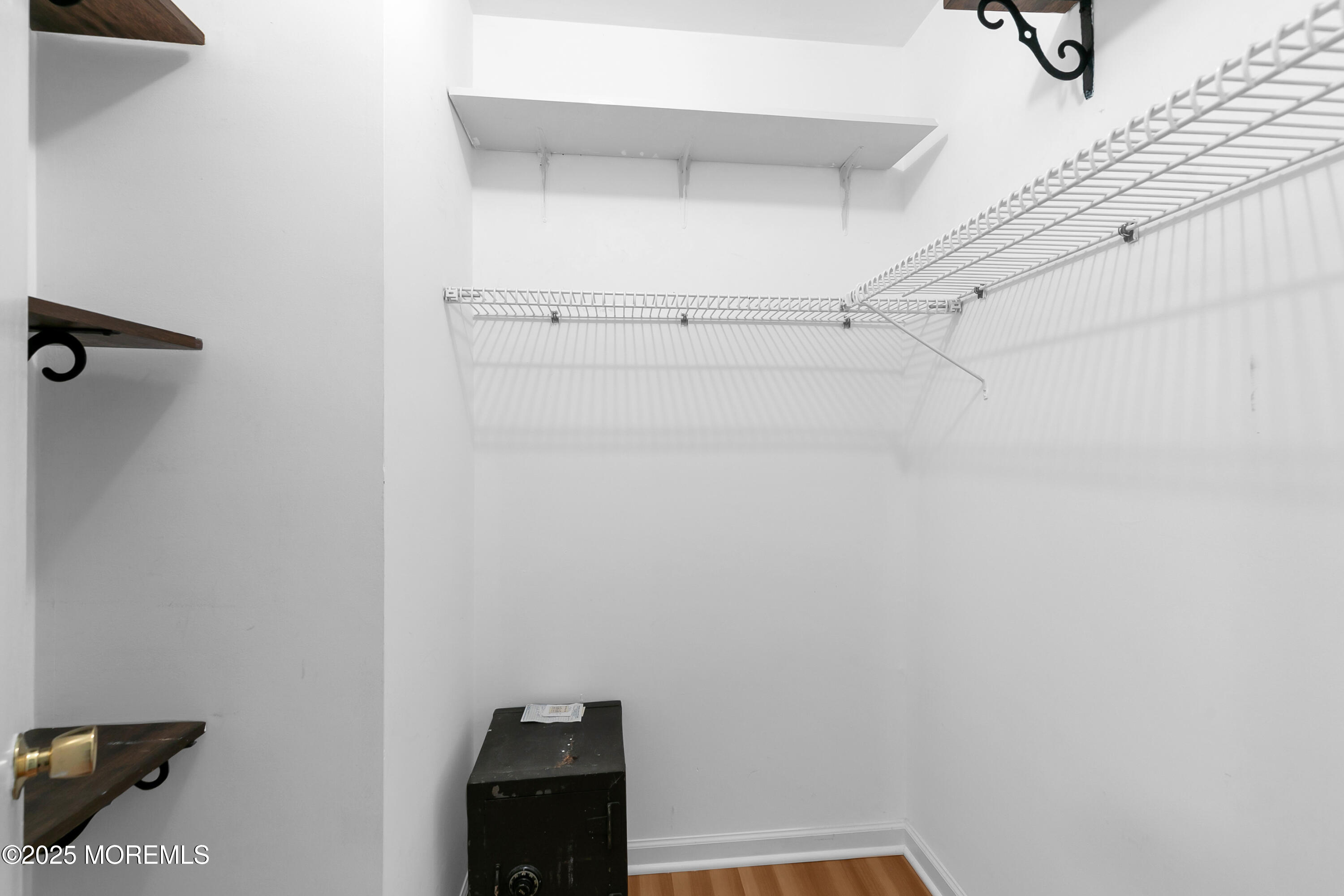 26 Meadow Green Circle, Unit K Manalapan, NJ 07726 - Photo 17 of 27 a view of small space with racks on the wall