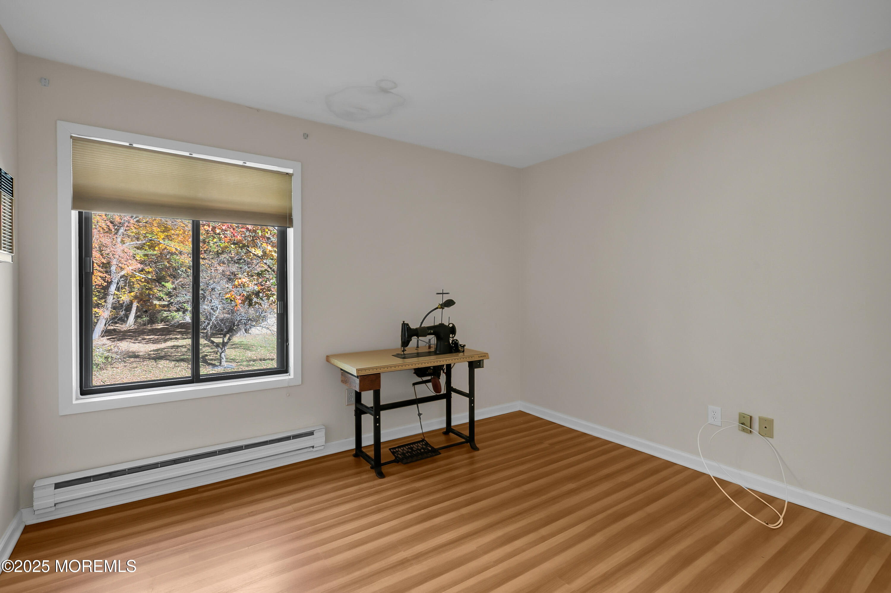 26 Meadow Green Circle, Unit K Manalapan, NJ 07726 - Photo 18 of 27 a view of a livingroom with wooden floor and a window