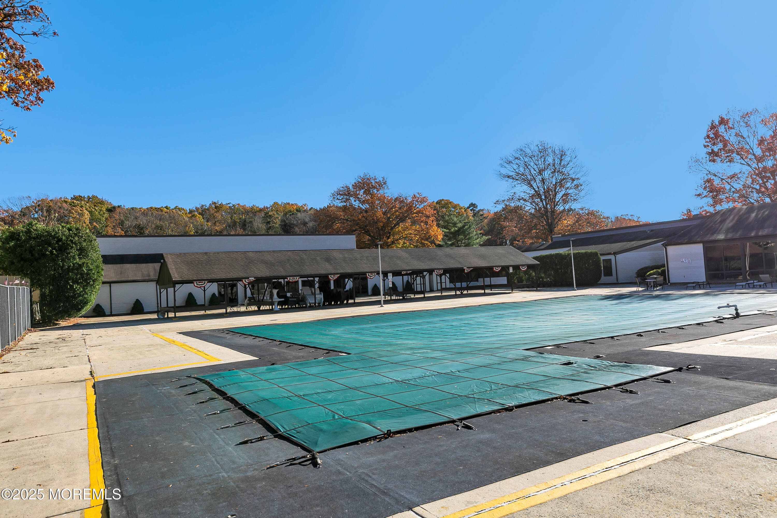 26 Meadow Green Circle, Unit K Manalapan, NJ 07726 - Photo 21 of 27 a view of swimming pool with a yard and plants