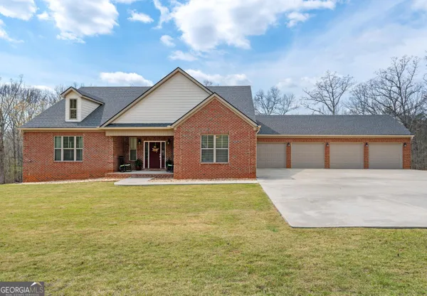 a front view of a house with yard