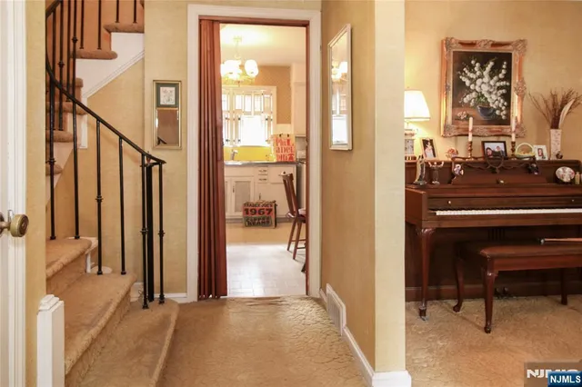 a view of a livingroom with furniture and front door