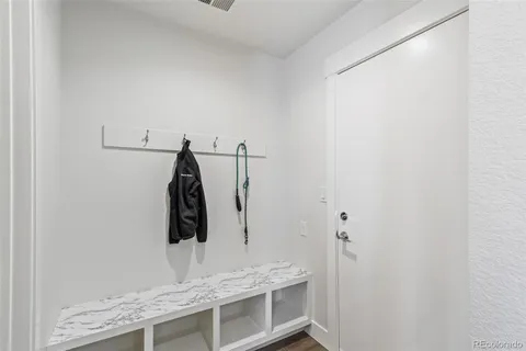 a bathroom with a granite countertop sink and vanity