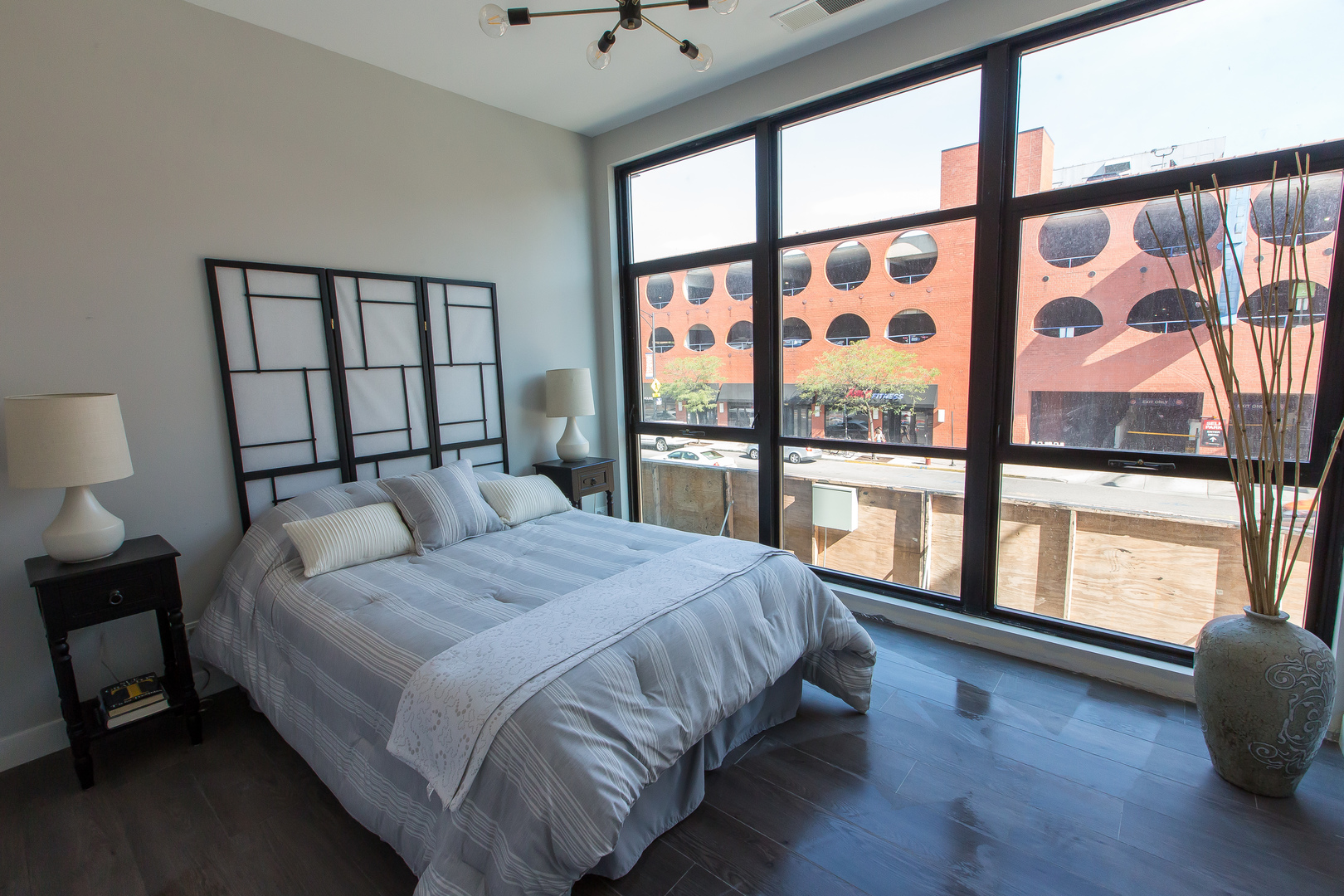 Undisclosed Address Chicago, IL 60610 - Photo 7 of 14 a bedroom with a large bed and a large window