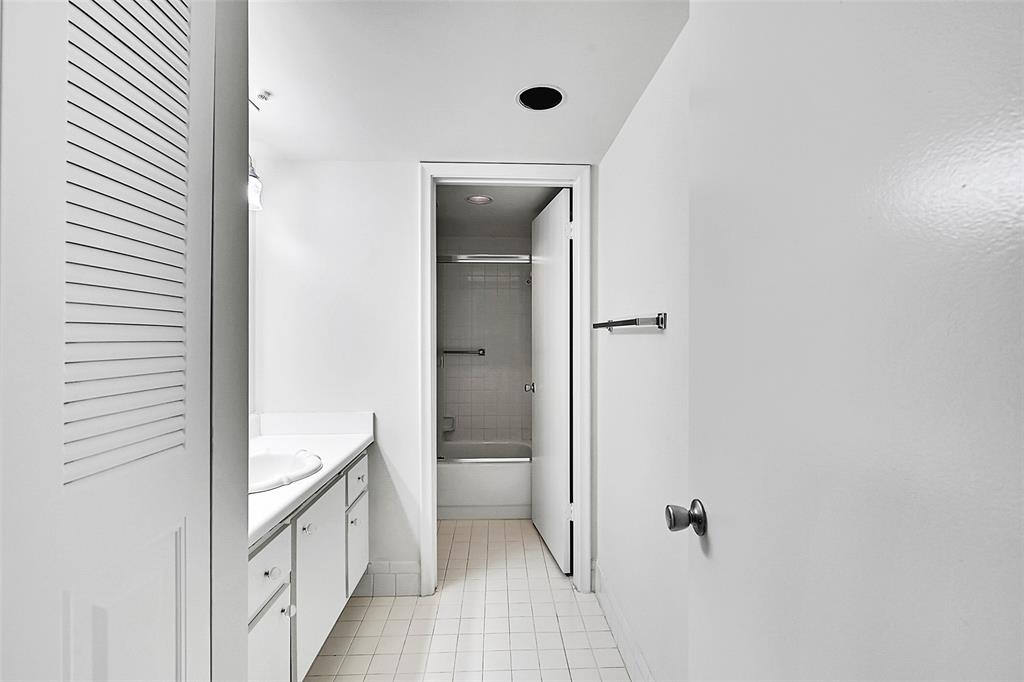 1902 Bermuda Circle, Unit H3 Coconut Creek, FL 33066 - Photo 13 of 25 a bathroom with a sink and mirror