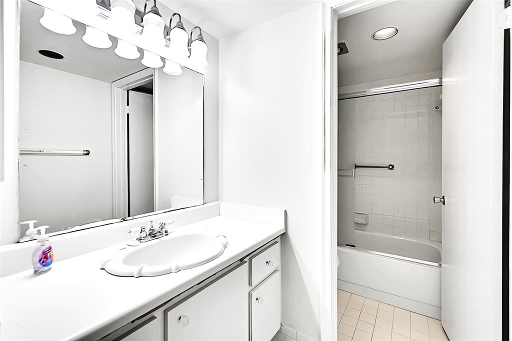 1902 Bermuda Circle, Unit H3 Coconut Creek, FL 33066 - Photo 14 of 25 a bathroom with a sink vanity tub and shower