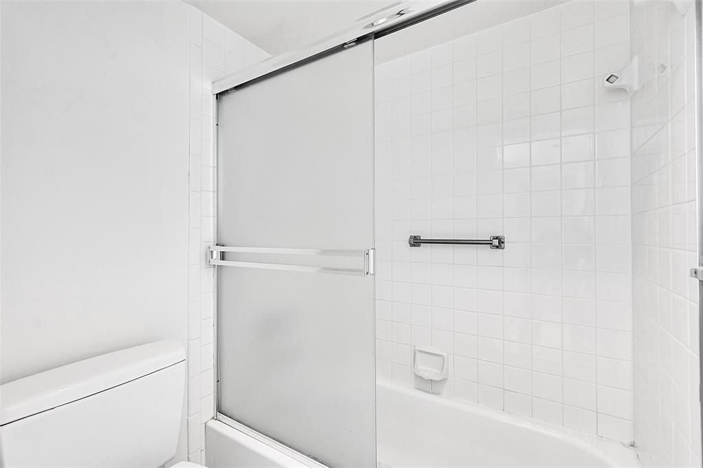 1902 Bermuda Circle, Unit H3 Coconut Creek, FL 33066 - Photo 15 of 25 a bathroom with a shower and a bath tub