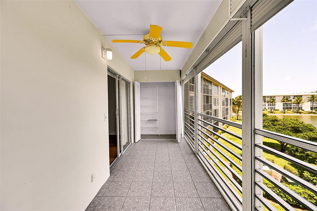 1902 Bermuda Circle, Unit H3 Coconut Creek, FL 33066 - Photo 21 of 25 a view of a balcony with wooden floor