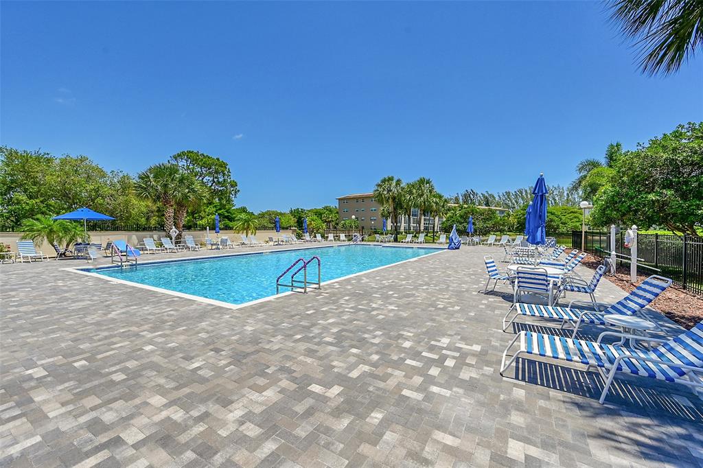 1902 Bermuda Circle, Unit H3 Coconut Creek, FL 33066 - Photo 23 of 25 a view of a swimming pool with a patio