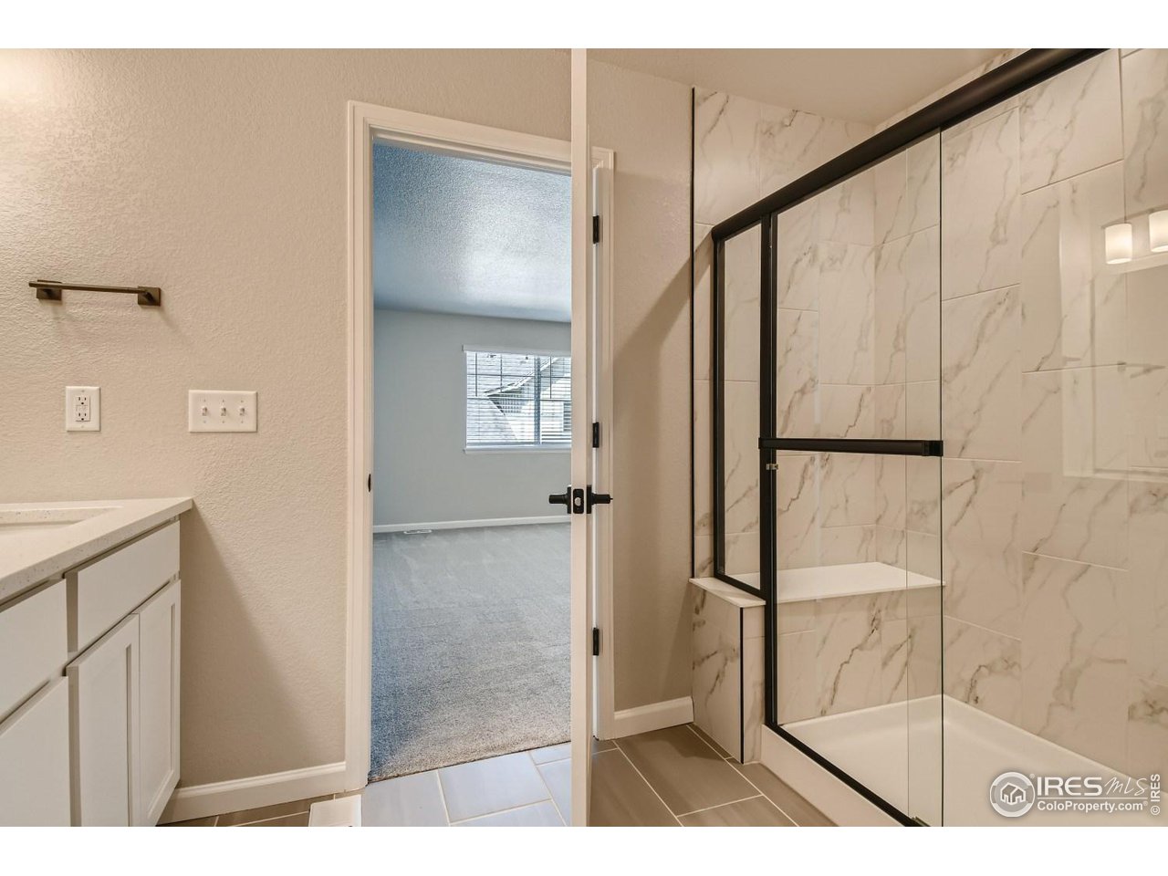 2540 Brookstone Drive, Unit B Milliken, CO 80543 - Photo 17 of 25 a bathroom with a shower