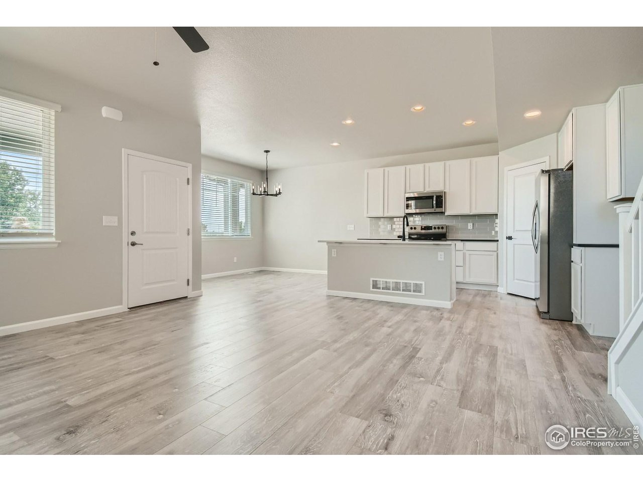 2540 Brookstone Drive, Unit B Milliken, CO 80543 - Photo 2 of 25 a view of kitchen with wooden floor