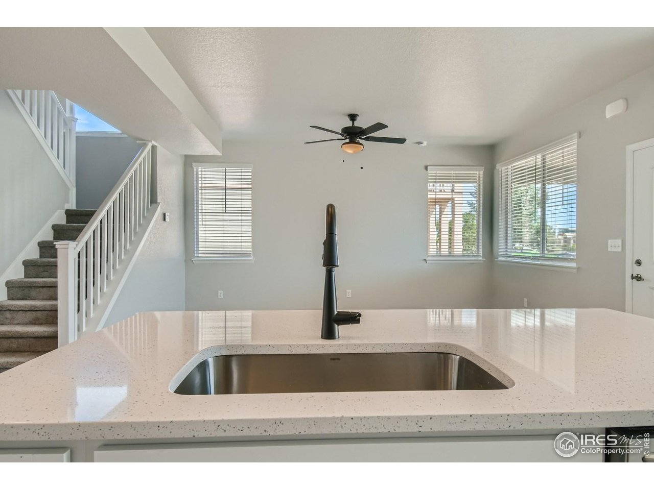 2540 Brookstone Drive, Unit B Milliken, CO 80543 - Photo 9 of 25 a view of kitchen and sink